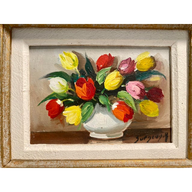 Small vintage painting featuring tulips. Oil on Masonite measures 4” x 5 1/2”. With nice gold flecked layered frame,...