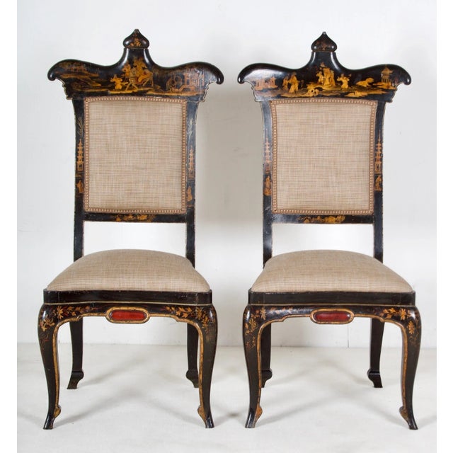 This pair of chairs is exquisitely styled, the chinoisery is fine and European in style. The chairs are raised on "ballet...