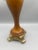 Striking vintage candleholder featuring a beautifully shaped warm wood body accented with ornate gold-tone metal...