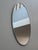 Beautiful vintage mirror. Italy, 1970s. A polished, chrome-plated cylindrical metal frame surrounds and supports this...