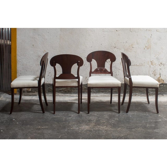 Swedish Karl Johan (Biedermeier) Revival Napoleon Hat Dining Chairs. Shovel-shaped backrest with decorative scroll carved...