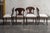 Swedish Karl Johan (Biedermeier) Revival Napoleon Hat Dining Chairs. Shovel-shaped backrest with decorative scroll carved...