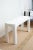 This vintage white lacquered over wood rectangle console or sofa table has been newly restored and re painted in white. It...