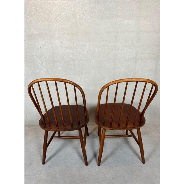 2 bar chairs. Probably for Ercol. Beautiful vintage condition. The signs of use provide a pleasant patina. Height: 89cm....