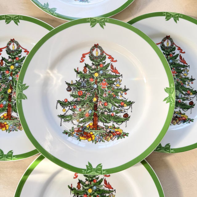 A charming and collectible set of eight vintage Christmas dinner plates from the beloved Yule Tide pattern by Georges...