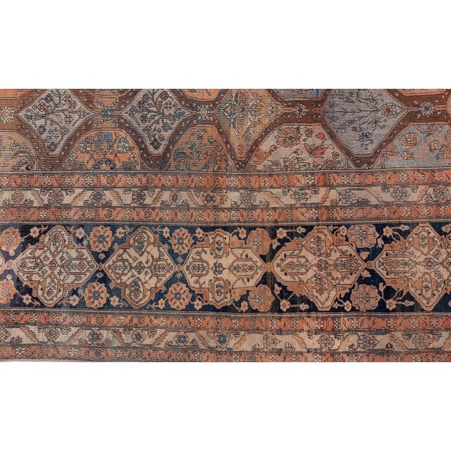A highly-decorative late 19th century Persian Kashan antique rug with an allover lattice of medallions and roundels...