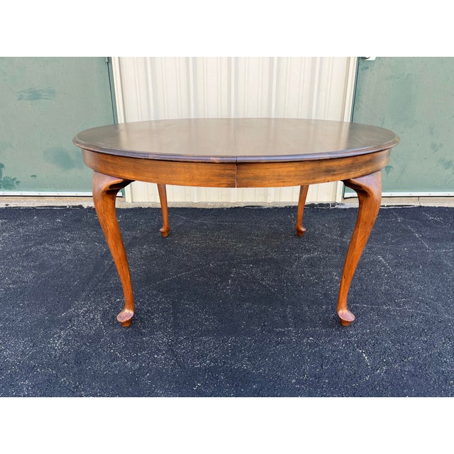 A beautiful 54” diameter round oak dining table from the early 1900s. While many round oak tables are supported by a...