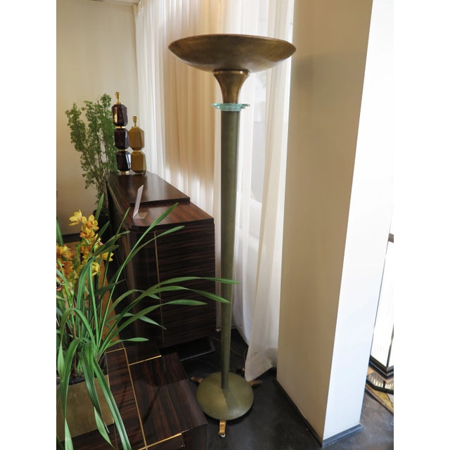 Green Art Deco torchiere with antiqued gold leaf metal shade and feet. Three graduated frosted glass rings grace the...