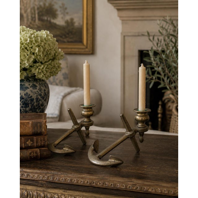 A charming pair of mid-20th-century candlestick holders cast in solid brass and modeled as ship’s anchors. Each elongated...