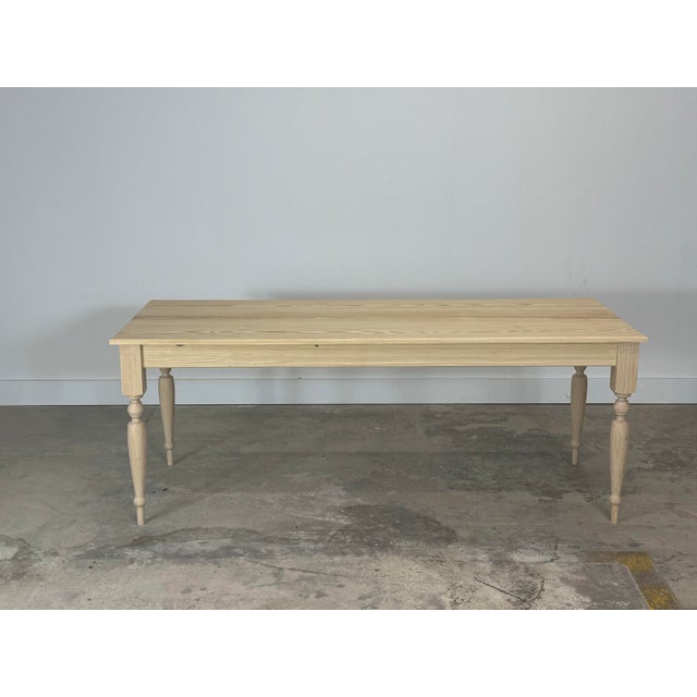 Crafted from reclaimed heart pine, this French harvest table embodies rustic elegance with timeless charm. The wood’s rich...