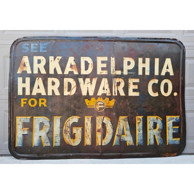 A scarce, likely one-of-a-kind, antique American Frigidaire enameled metal advertising sign, early 20th century, period...
