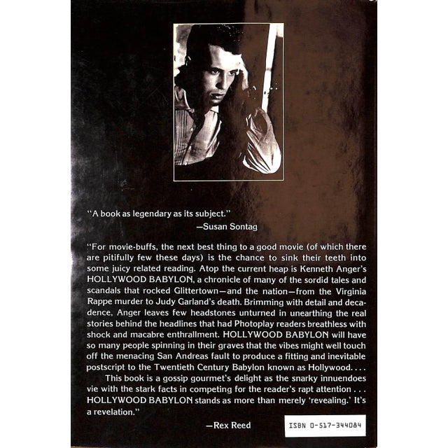 ANGER, Kenneth [289] pp. Bell Publishing Company 1981 10 3/8" x 7 3/8" Hollywood Babylon is a controversial book by...