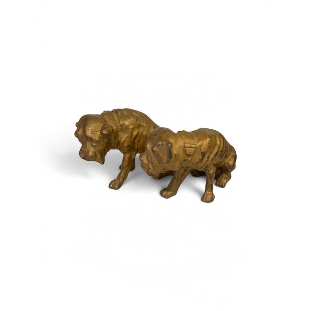 An exceptional pair of French 19th-century cast bronze architectural fireplace chenets (andirons) masterfully modeled as...