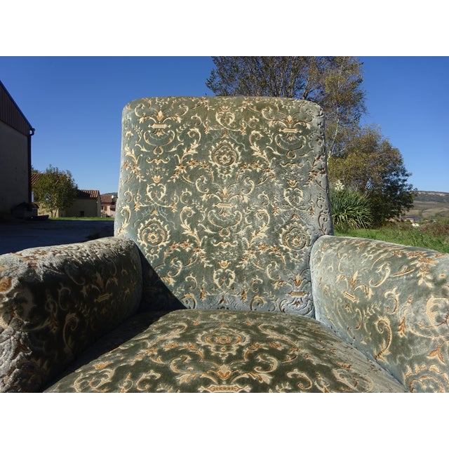 Antique Napoleon III style lounge chair, traditionally made in France in the early 20th century. It features a wraparound...