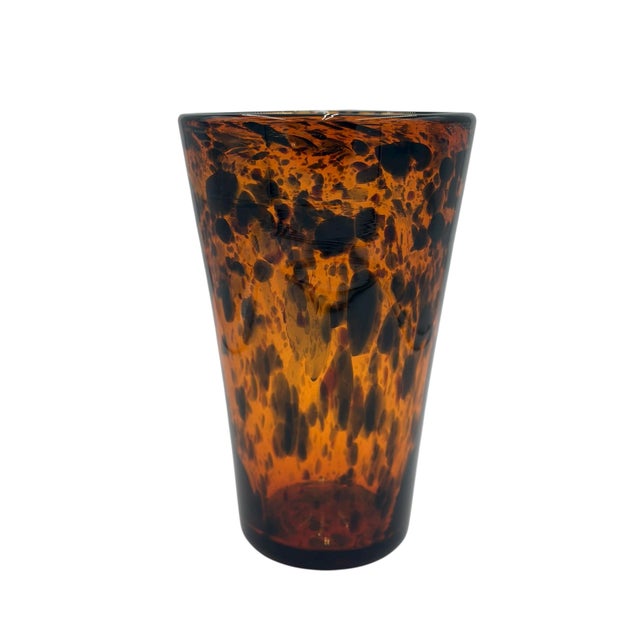 AERIN Tortoise Glass Vase A striking and sculptural AERIN tortoise glass vase in rich amber and espresso tones, showcasing...