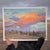 This gouache painting captures a serene landscape at Chatfield Farms, showcasing a soft interplay of colors in the sky,...