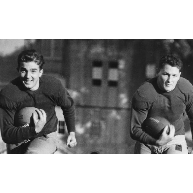 1935 photograph of the quarterbacks Nick Pappas (2016-2015) and Glenn Thompson of the USC Trojan football teams....