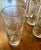 This set of eight clear glass highball tumblers feature a prominent etched palm tree design around the circumference....
