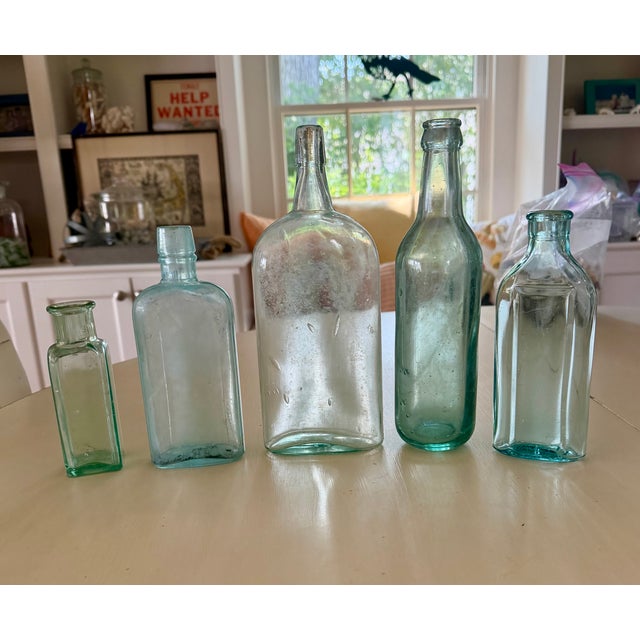 Set of five antique light green/aqua apothecary bottles to brighten up any display. From left: -Small square light green...