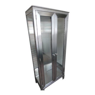 Mid-Century Storage Cabinet of Stainless Steel With Double Glass Doors and Side Panels. For Sale