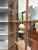 This is a mid 19th century handcrafted walnut corner cupboard. This handsome corner cabinet features it’s original...