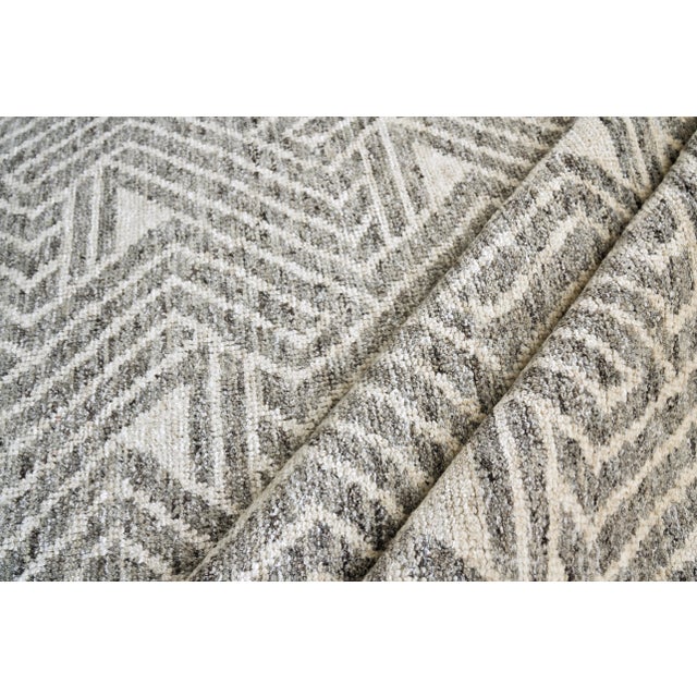 The Eaton rug is hand knotted with a low nubby wool pile with a shimmer of bamboo fiber for highlights. This collection...