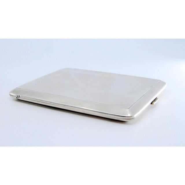 Matte Silver Cigarette Case with Crossed Bands, in Very Good conditions. Designed 1890 to 1919 This piece has an...