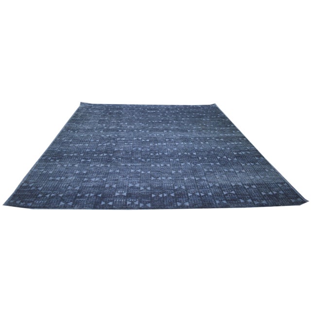 Contemporary Scandinavian hand knotted rug with geometric pattern and soft texture.