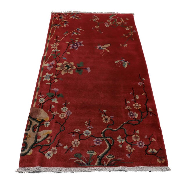 This vintage Chinese Art Deco wool rug is more than just decor; it's a feeling. Imagine soft, muted rose hues and a garden...