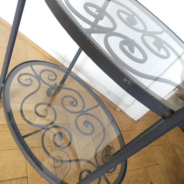 Decorative oval, Italian serving car. Forged iron with 2 glass panels. Worked very nicely and elaborately. It is wanted...