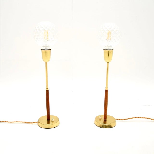 A smart and stylish pair of Swedish vintage teak and brass table lamps. They were recently imported from Sweden, they date...