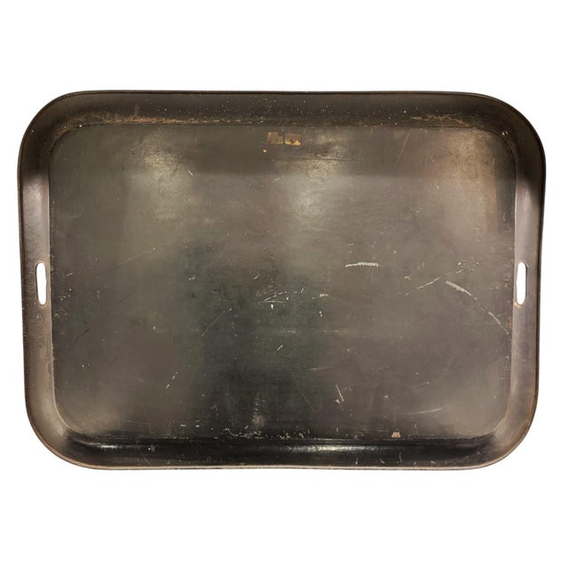 This monumental tray stands as a rare survivor from the golden age of english decorative metalware. Measuring 76.5 cm, it...