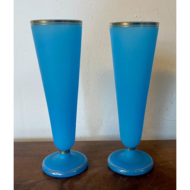 Pair antique 19th century French opaline trumpet shaped footed vases. Bright blue with gilt highlights. Each measures 7...