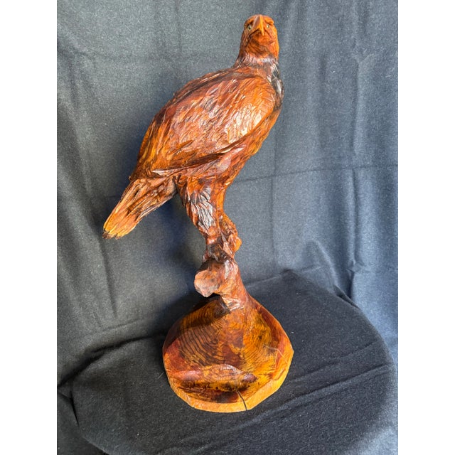 Very large hand carved eagle. It is a nod to sweeter times. Sculpted from a huge cedar log. This piece originated...