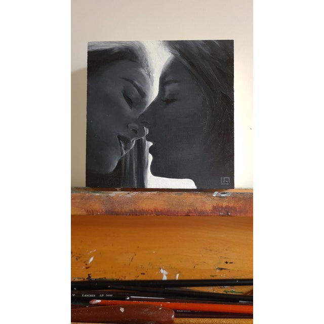 This intimate oil painting captures the tender moment of two figures poised for a kiss, their faces softly merging in a...