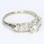 Here is a 14k White Gold Engagement Ring featuring a ~0.75ct. M/SI1 Round Cut White Diamond Center & Round Accent Diamonds...