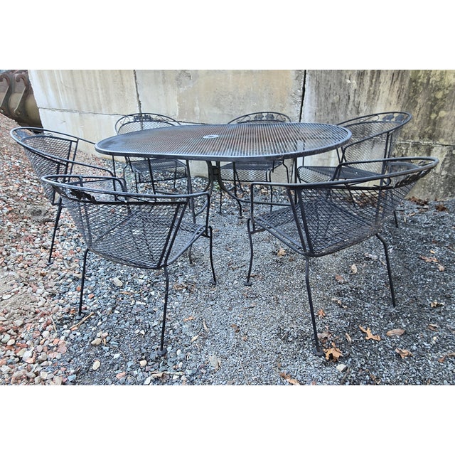 Vintage Wrought Iron Outdoor Dining Set 7 Pieces This Wrought Iron Patio Set consists of an Oval 60" Table and 6 chairs....