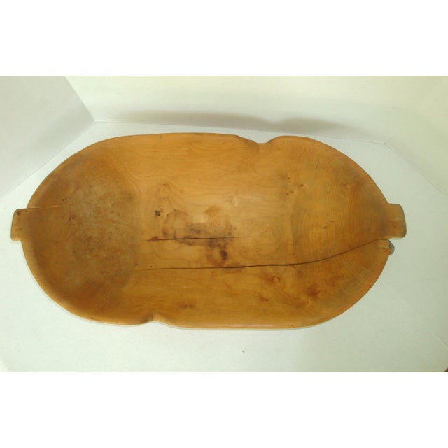 Authentic unusual antique large oblong hand carved wood bread dough trough. Each end of the bowl has a small square ear...