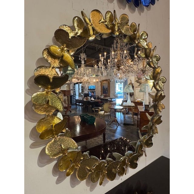The Decorative Butterfly Mirror is a luxurious and stylish addition to any home decor. Made of gold Murano glass, this...