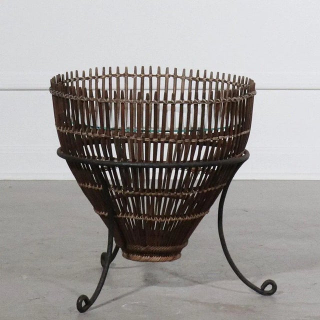 Rattan fish basket framed with iron tripod form base. Designed in Italy by Franco Albini for Raymor. Wonderful vintage...