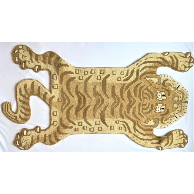 This is a whimsical rug in the shape of Tibetan Tiger. It is called a Persian hunting rug and they are often done with...