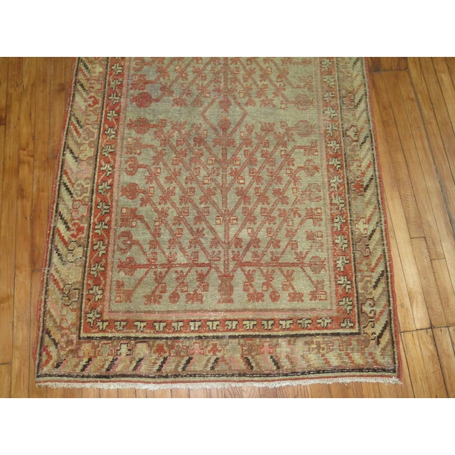 A late 19th century accent size khotan rug