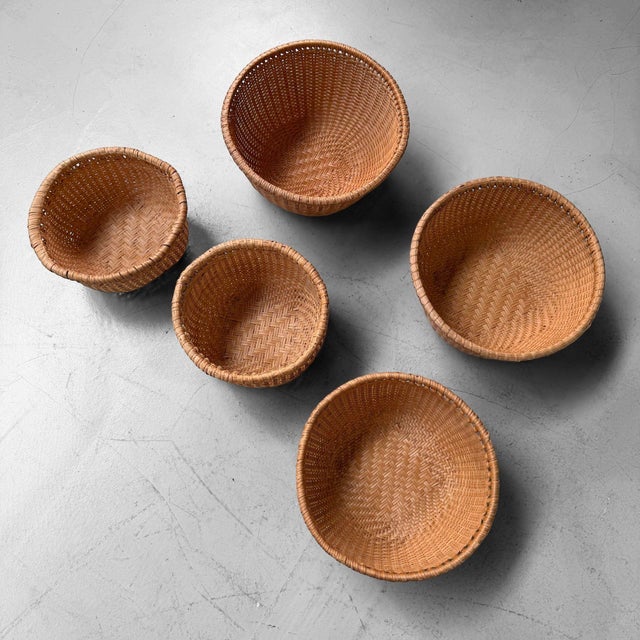 A highly decorative set of five vintage Japanese bamboo baskets, dating from the 1970s–1980s. The baskets have a rounded,...