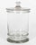 A vintage French glass apothecary or candy jar. Heavy canister form, flat lid with glass knob. The inside rim is chipped...