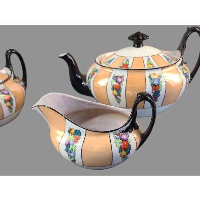 Add a touch of vintage elegance to your teatime with this stunning 3-piece tea set from Czechoslovakia. The set features a...