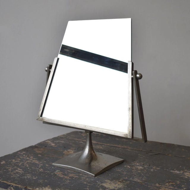 Vintage Modernist Vanity Mirror with Angular Brushed Steel Frame and Trumpeted Base, Circa 1950s-60s. Angular double-sided...