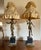 Antique art nouveau style figural table lamps featuring a romantic matched couple in spelter. These figures stand in a...