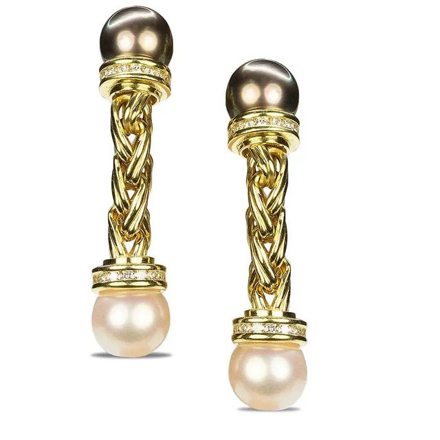 18k Earrings with one Tahitian and one South Sea pearl and 1.28 carats of round diamonds.