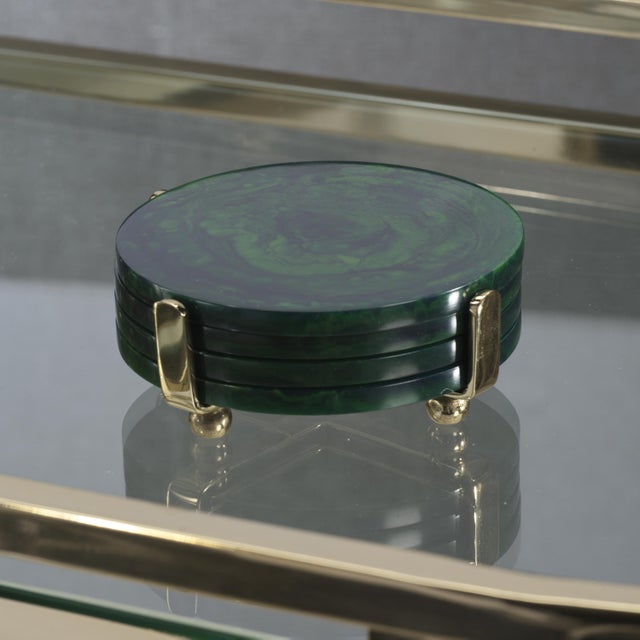 Protect your surfaces with style using the Spiga Resin Coasters. These colorful, round resin coasters are stored in a...