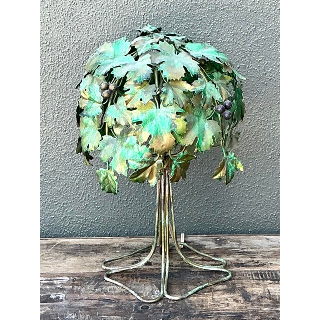 This exquisite vintage Italian table lamp is a masterclass in botanical artistry, capturing the whimsical luxury of the...